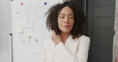 Confident Businesswoman Presenting in Modern Office Meeting Room