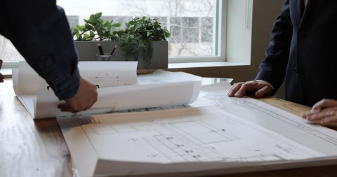 Architects Collaborating on Project Plans in Modern Office - Download Free Stock Images Pikwizard.com