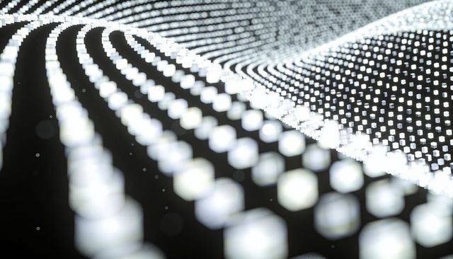 Undulating glowing voxel grid creating futuristic monochrome wave pattern with bokeh depth