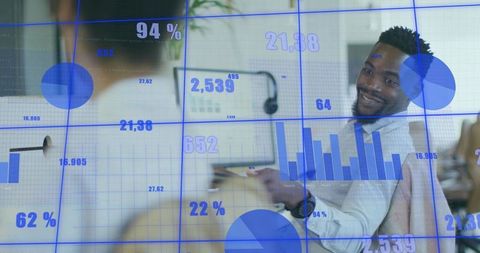 Business Team Analyzing Digital Statistics in Modern Office