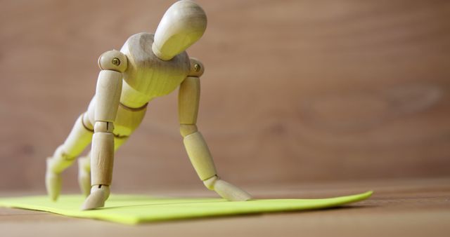 Wooden Mannequin Practicing Yoga on Yoga Mat - Download Free Stock Images Pikwizard.com