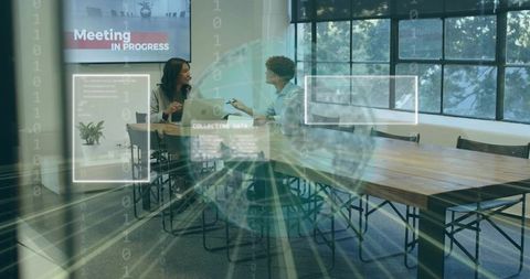 Coworkers discussing laptop in boardroom with meeting in progress hud and data overlay