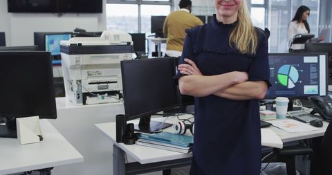 Confident Businesswoman Posing in Bright Office Environment