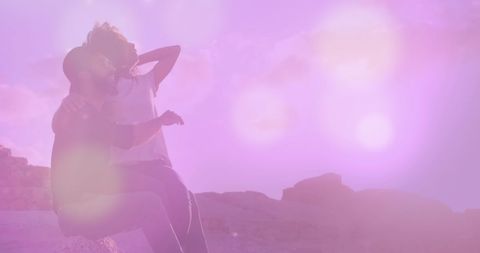 Romantic couple embracing in sunset with bokeh effect