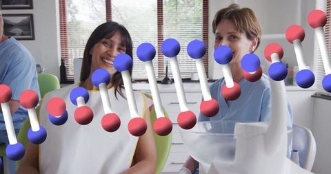 Smiling Patient with Dentist in Modern Dental Clinic