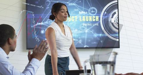 Product leader presenting launch with futuristic HUD dashboard, team collaboration in boardroom