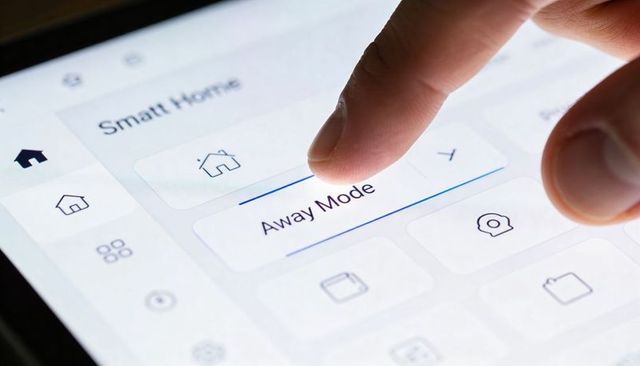 Tapping Finger Activating Away Mode on Smart Home Tablet Interface for Remote Security