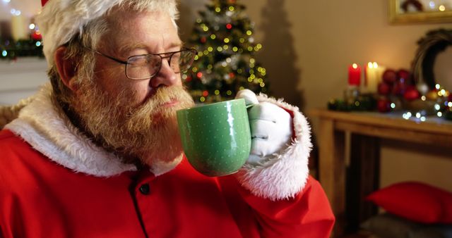 Santa Claus Drinking Hot Beverage in Festively Decorated Room - Download Free Stock Images Pikwizard.com