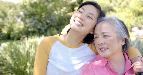 Happy Multigenerational Asian Family Bonding Outdoors