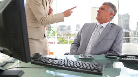 Manager Expressing Displeasure with Employee in Office Setting