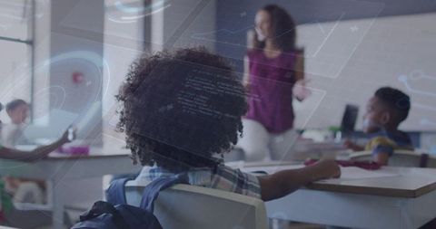 Curly-haired student watching teacher with augmented reality HUD in modern classroom