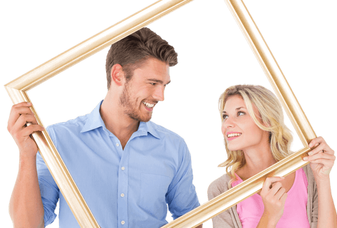 Charming young couple holding transparent picture frame smiling