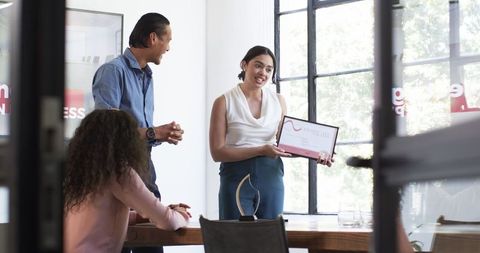 Diverse Professionals Celebrating Reward Ceremony in Modern Office