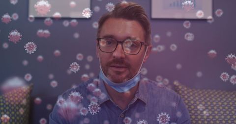 Caucasian Businessman in Office with Virus Particles Floating