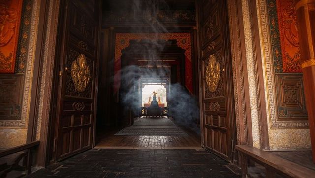 Tranquil temple corridor with kneeling worshipper and ritual smoke