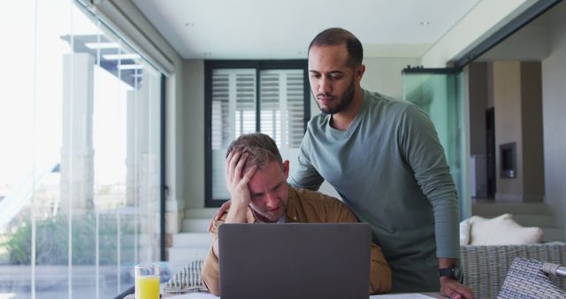 Concerned Man Comforting Partner While Working at Home - Download Free Stock Images Pikwizard.com