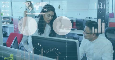 Multiracial Team Analyzing Digital Data in Modern Office