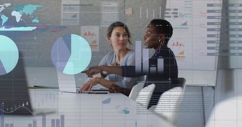 Businesswomen Collaborating in Meeting Room with Data Overlays
