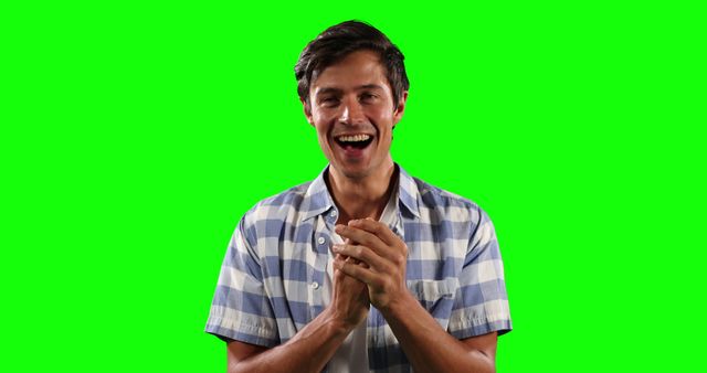 Excited Young Man Clapping in Joyful Moment Isolated on Green Screen - Download Free Stock Images Pikwizard.com