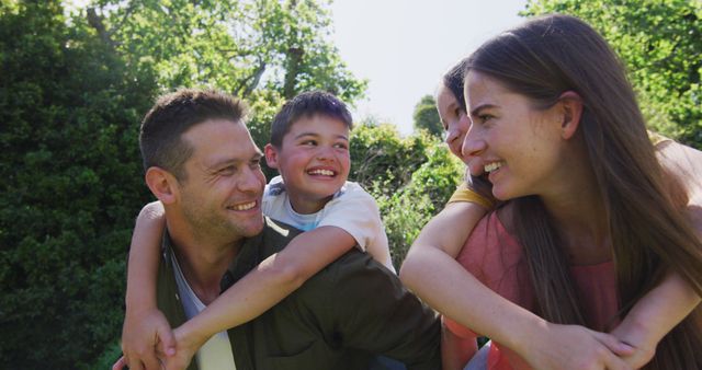 Happy Family Enjoying Outdoors in Sunshine - Download Free Stock Images Pikwizard.com