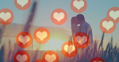 Romantic Outdoor Kiss at Sunset with Heart Symbols