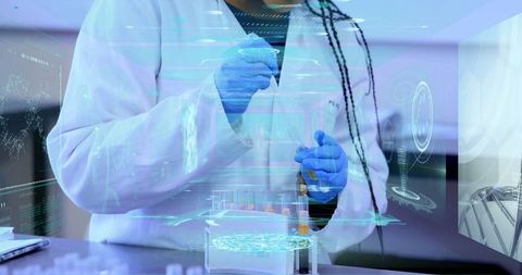 Scientist working with advanced technology and holographic data in lab