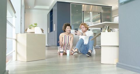 Couple Relaxing with Coffee During New Home Move