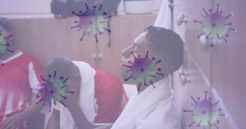 Disheartened soccer players in locker room amid global pandemic