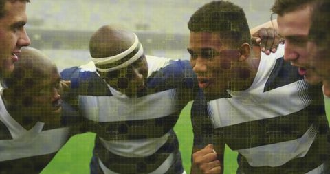 Rugby players in team huddle with digital overlay