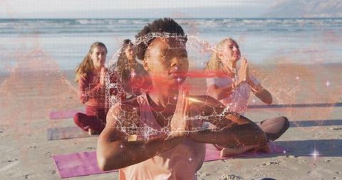 Group Yoga Meditation on Beach Embracing Wellness and Tranquility
