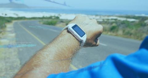 Man Using Smartwatch by a Road with Futuristic Data Overlay