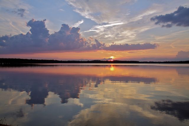 Serene Lake Sunset with Reflective Clouds - Download Free Stock Photos Pikwizard.com