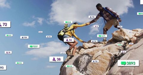 Young Hiking Duo Climbing Rock Displaying Digital Social Stats
