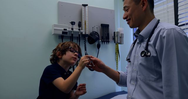 Doctor Interacting with Child During Office Visit - Download Free Stock Images Pikwizard.com