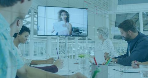 Team Collaborating on Video Conference in Modern Office