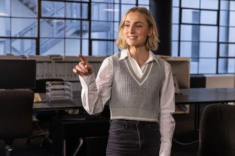 Cheerful Professional Woman Leading Office Presentation