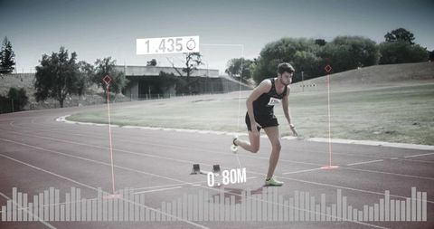 Sprinter launching from starting blocks on track with augmented hud performance overlays
