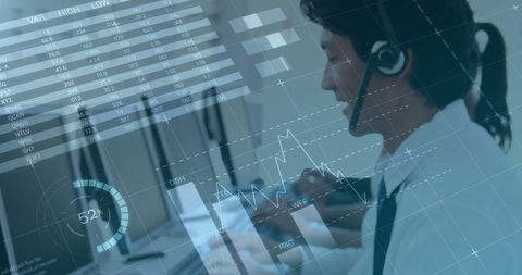 Asian businessman analyzing financial data with headset