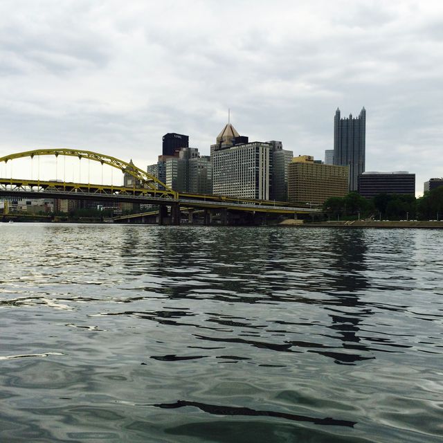 City Skyline View with Yellow Bridge Reflecting on River - Download Free Stock Images Pikwizard.com