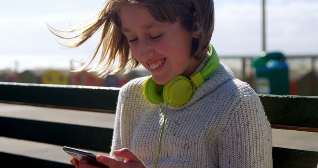 Cheerful Girl Enjoying Music and Smartphone at Beach - Download Free Stock Images Pikwizard.com