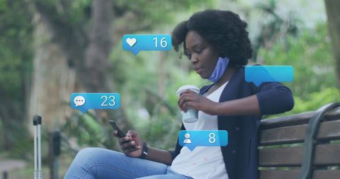 Woman Engages with Social Media on Smartphone in Park