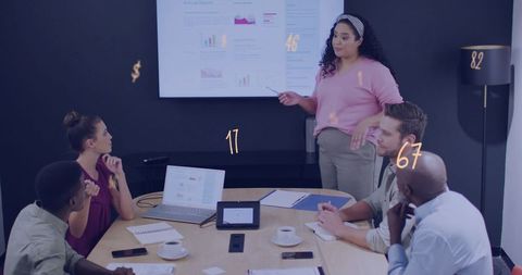 Woman presenting annual report in boardroom leading diverse team during strategic meeting