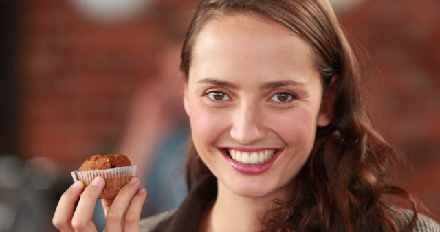 Smiling Woman Holding Homemade Muffin - Download Free Stock Images Pikwizard.com