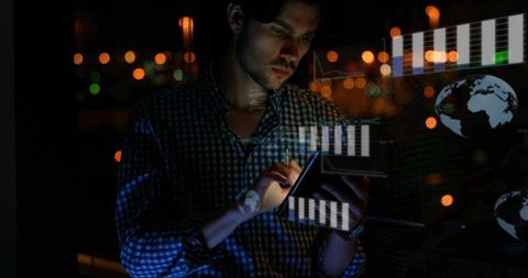 Professional Using Tablet Overlays Data Visualization in Dark Office