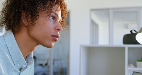 Young male designer focusing on creative project in office