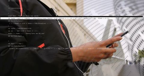 Female shopper holding smartphone tapping screen with code overlay in retail aisle