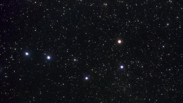 Image features distant galaxy GN-z11 and surrounding stars in Ursa Major constellation. Ideal for articles on astronomy, space exploration, cutting-edge scientific research, and cosmic discoveries. Suitable for educational materials, posters, and visual aids in understanding the universe's early stages.