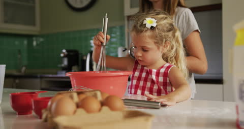 Sisters Making Pancakes at Home, Enjoying Creative Exploration
