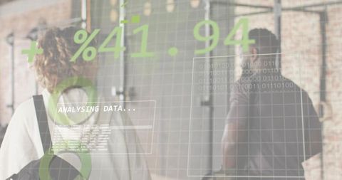 Colleagues walking through industrial corridor displaying data hud overlays and analytics