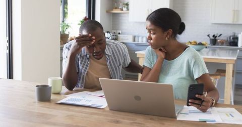 Stressed Couple Reviewing Household Finances in Modern Kitchen - Download Free Stock Images Pikwizard.com